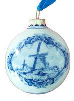 Decorative ornament with blue windmill design on one side and tulips on the other on a white background