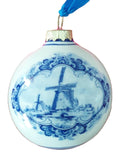 Decorative ornament with blue windmill design on one side and tulips on the other on a white background